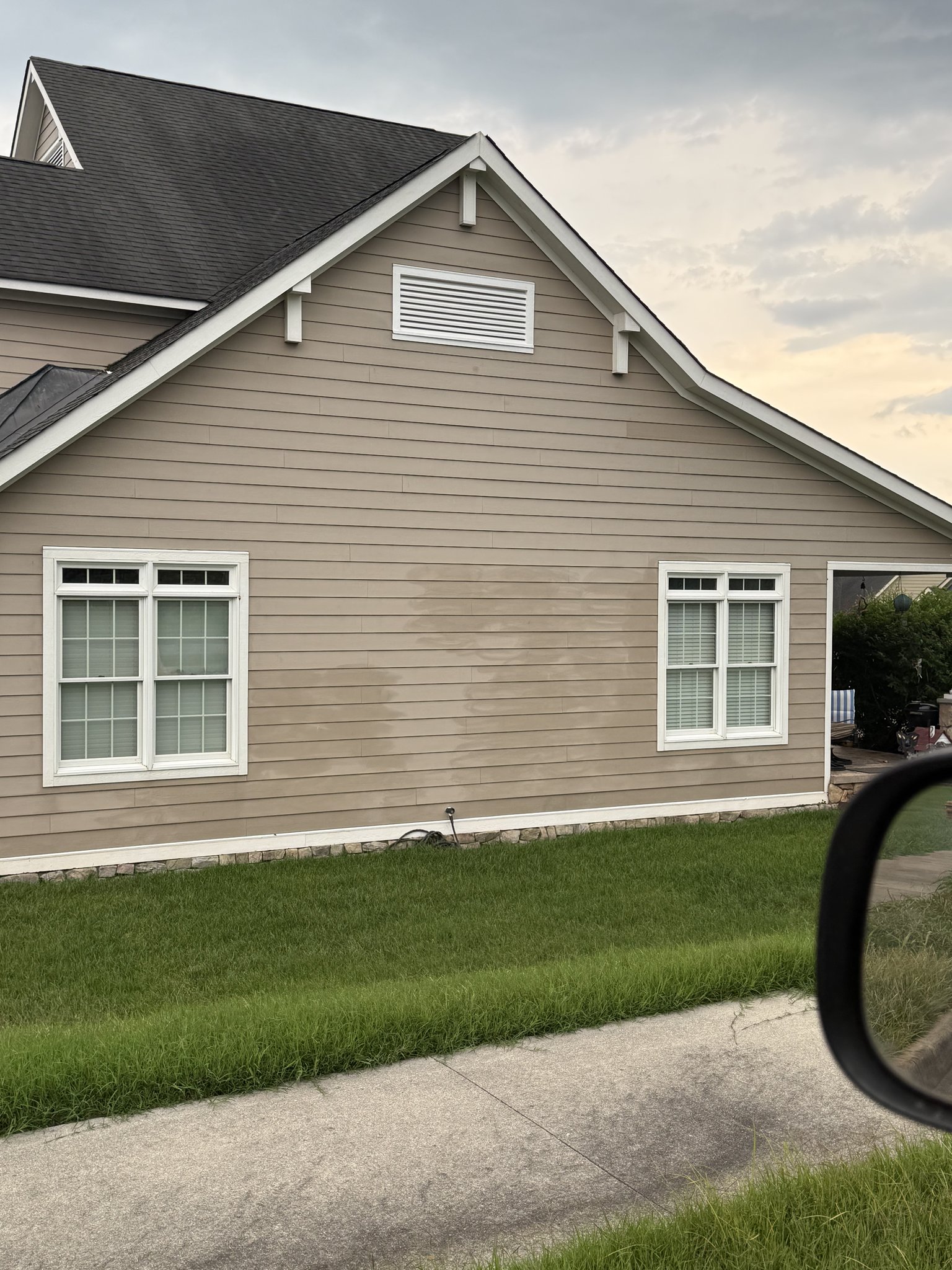 Permanent wand marks and blotches left on tan siding by high pressure washing