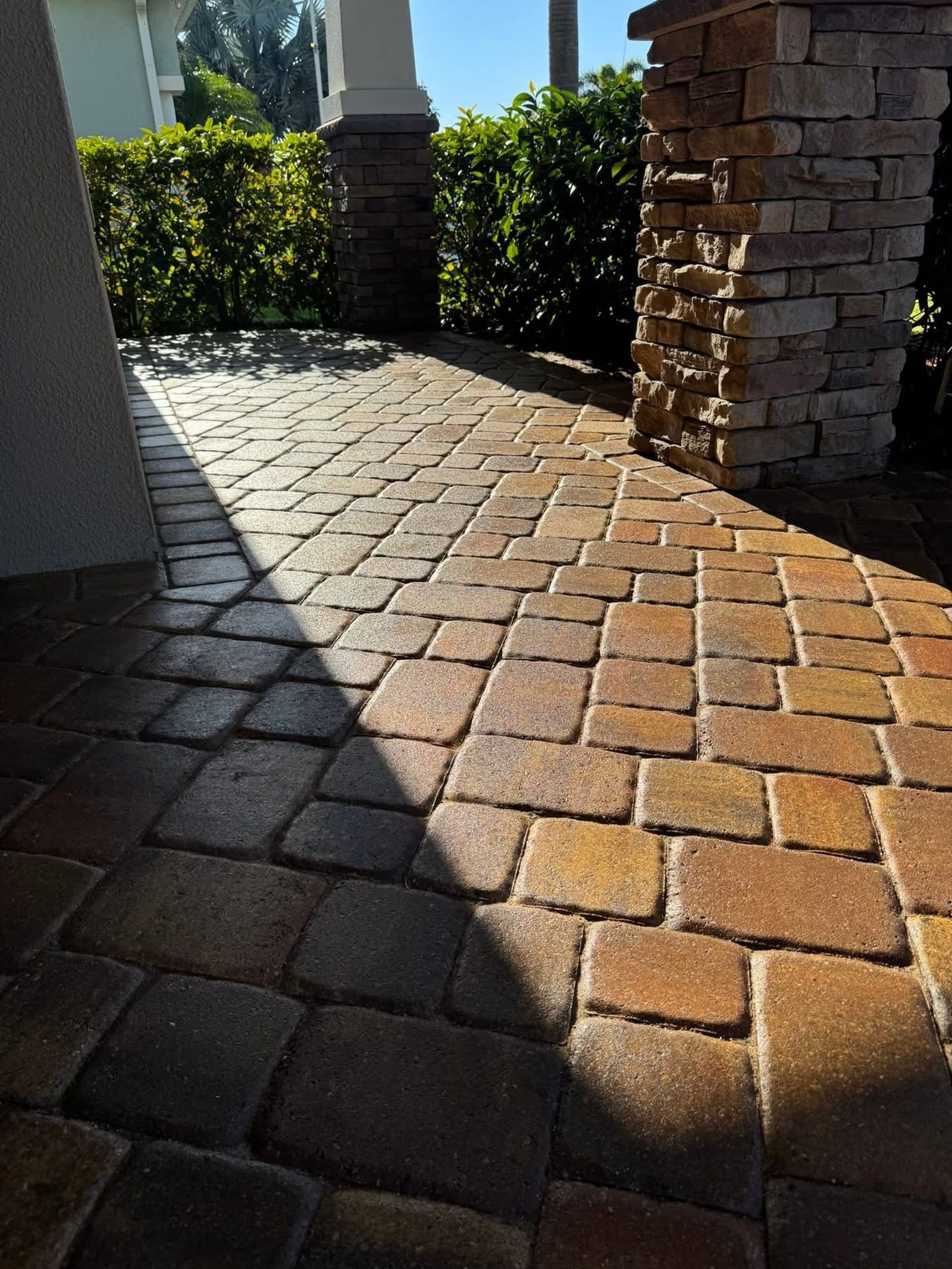 Freshly sealed pavers showing a high gloss sheen and deep color enhancement
