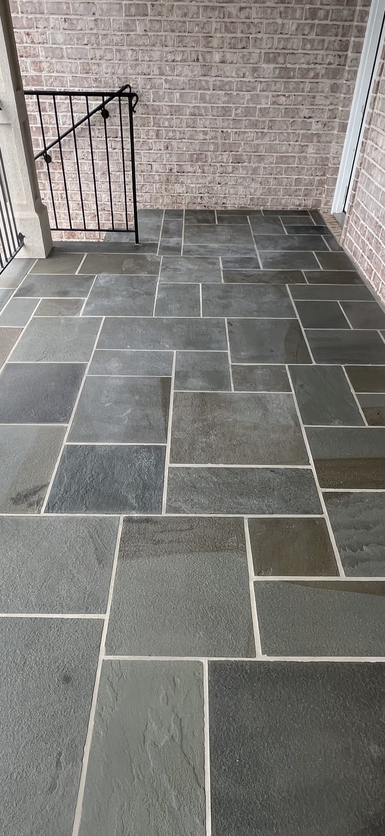 Bluestone patio with a hazy, clouded sealer coat
