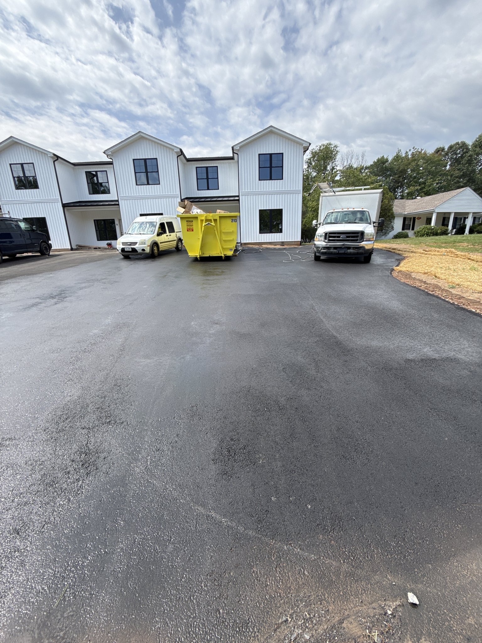 New asphalt parking lot after a water-only rinse in Lynchburg, VA
