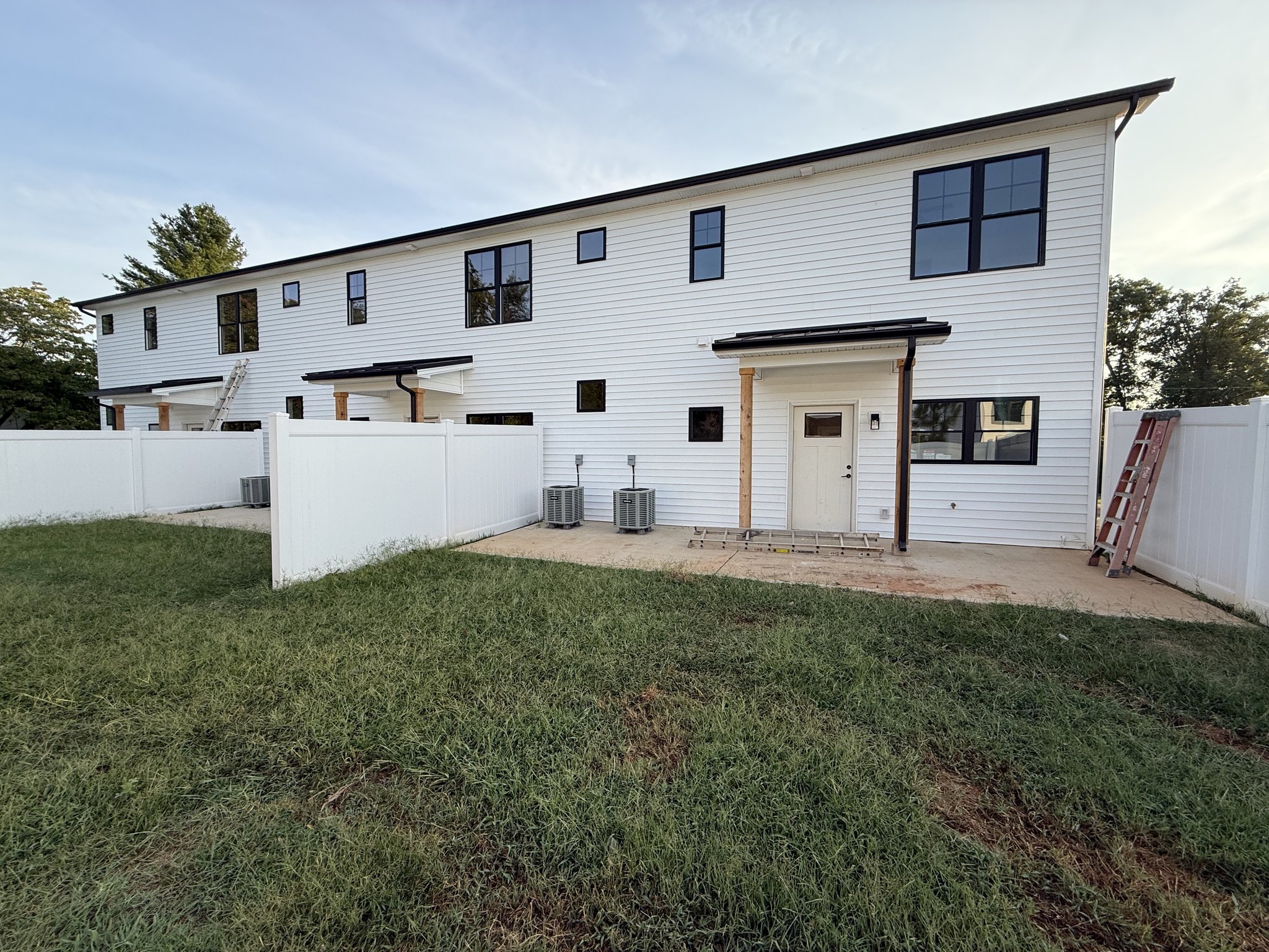 Rear elevation of the triplex on arrival, with ladders and equipment still staged