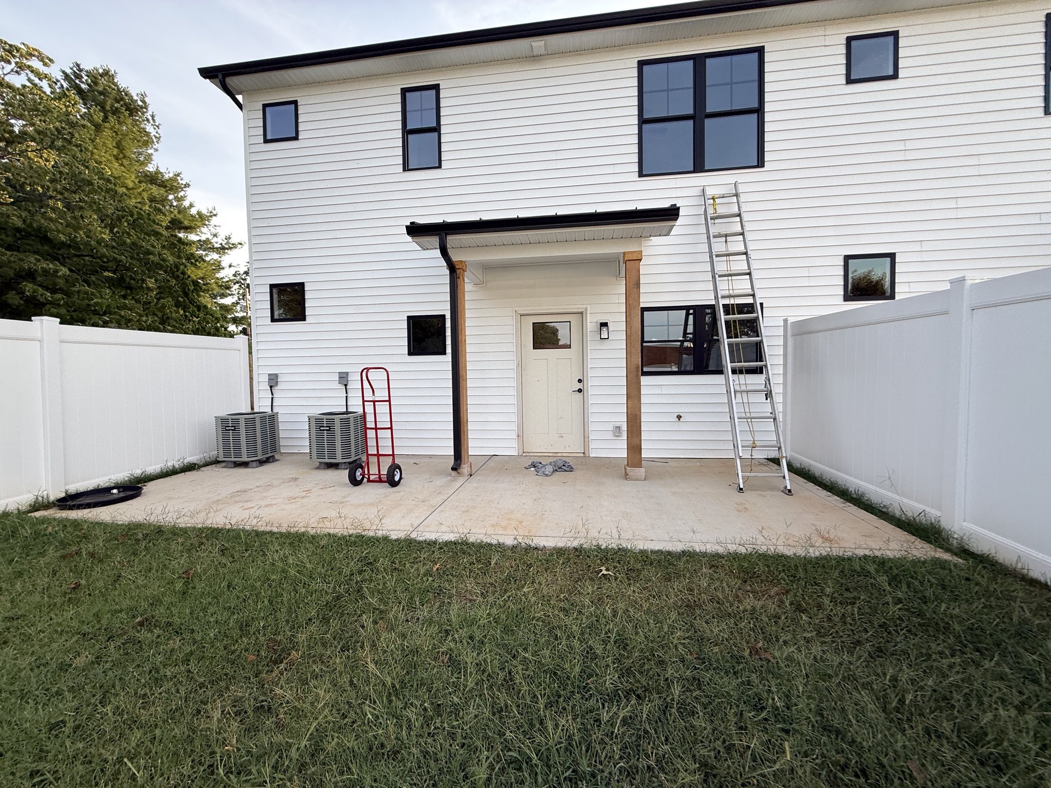 Rear patio on arrival before staging equipment off the concrete