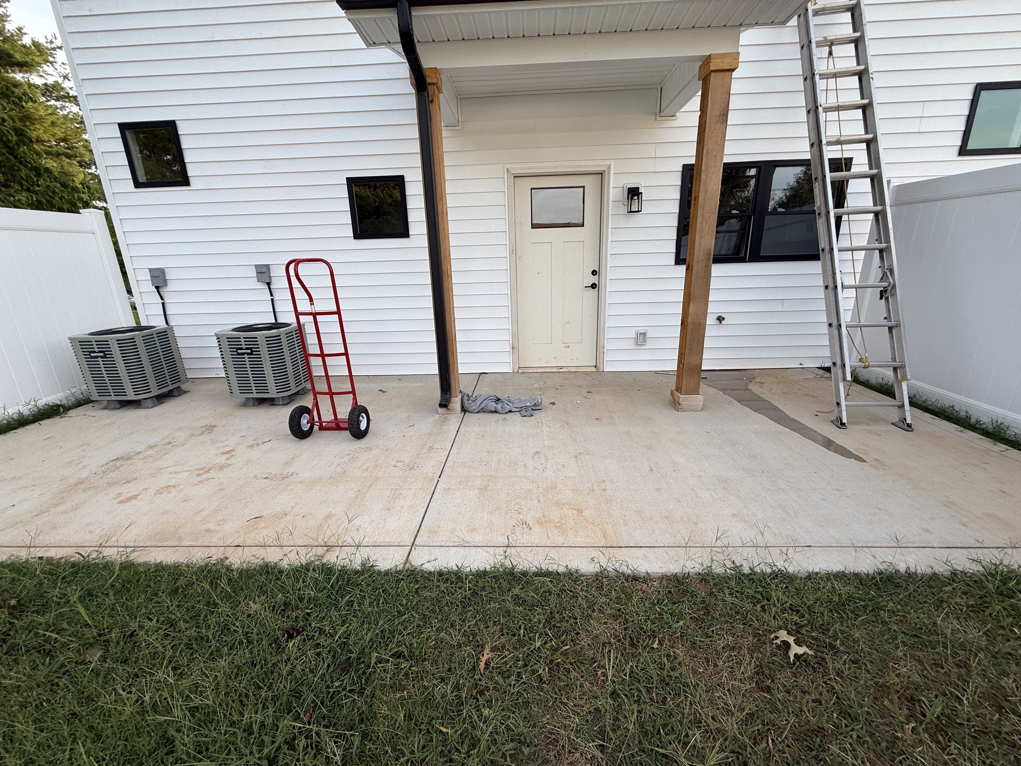 Close view of the stained rear patio concrete on arrival