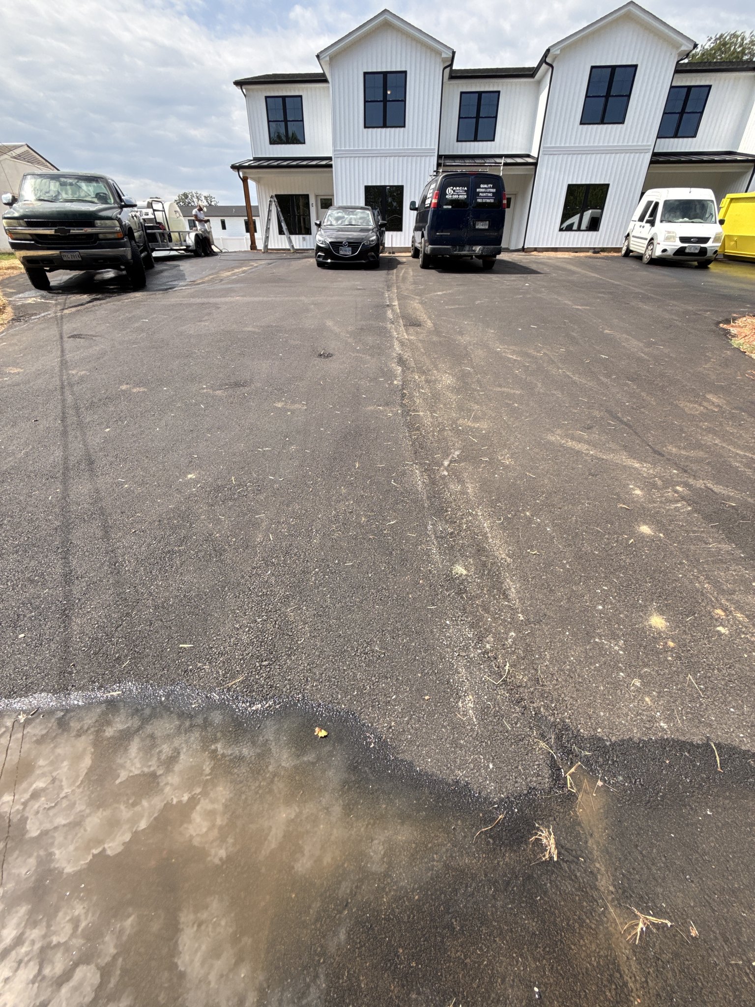 Water-only rinse in progress across the new asphalt parking lot in Lynchburg, VA