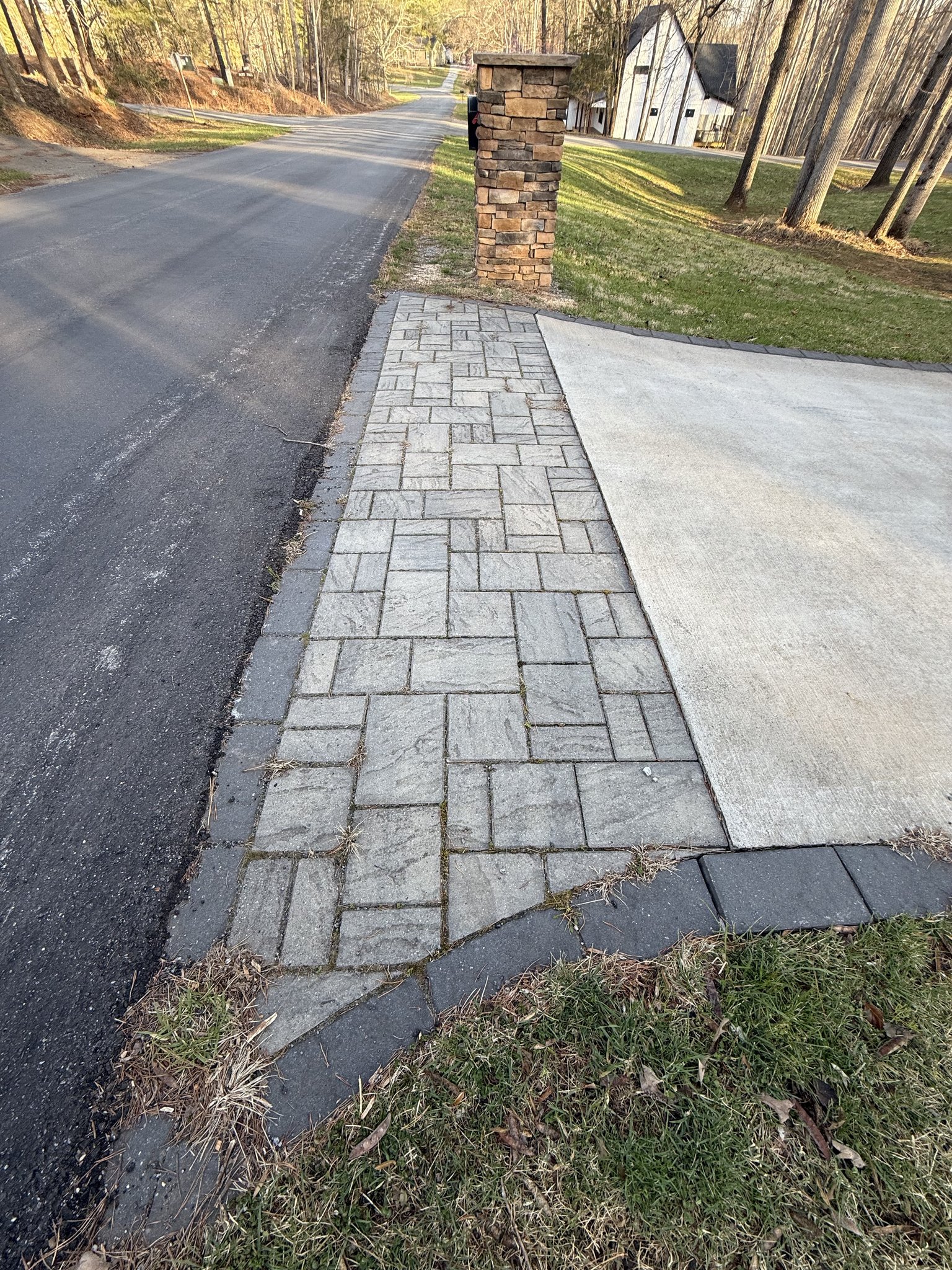 Faded paver walkway before cleaning and sealing in Huddleston, VA