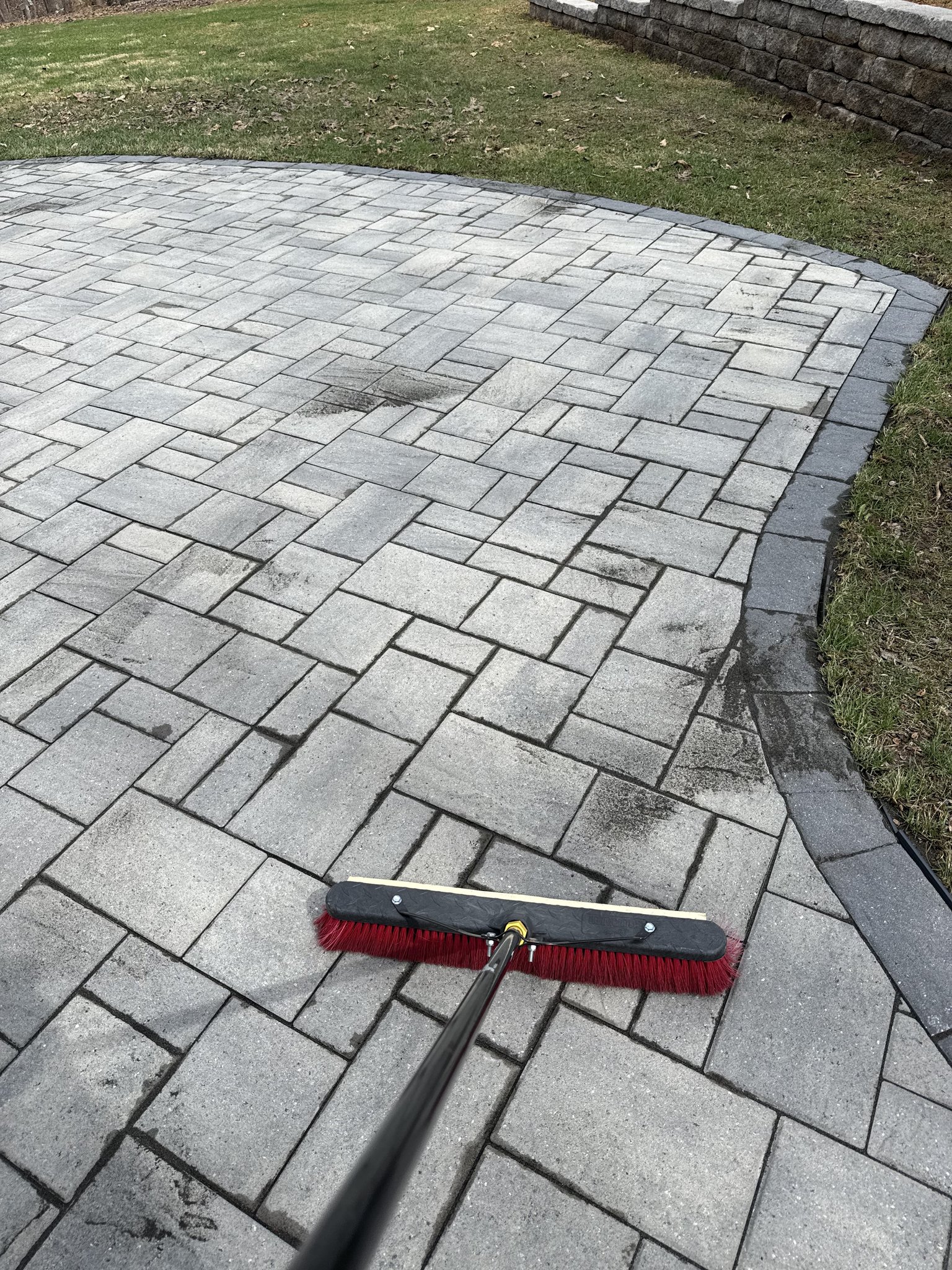 Sweeping fresh joint sand into paver joints in Huddleston, VA