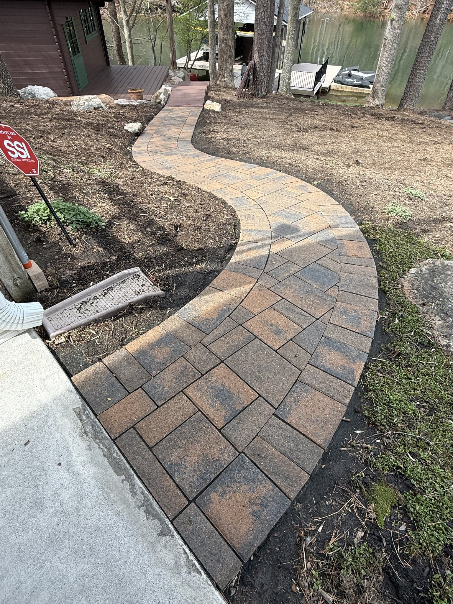 Restored S-curve paver walkway leading down to Smith Mountain Lake