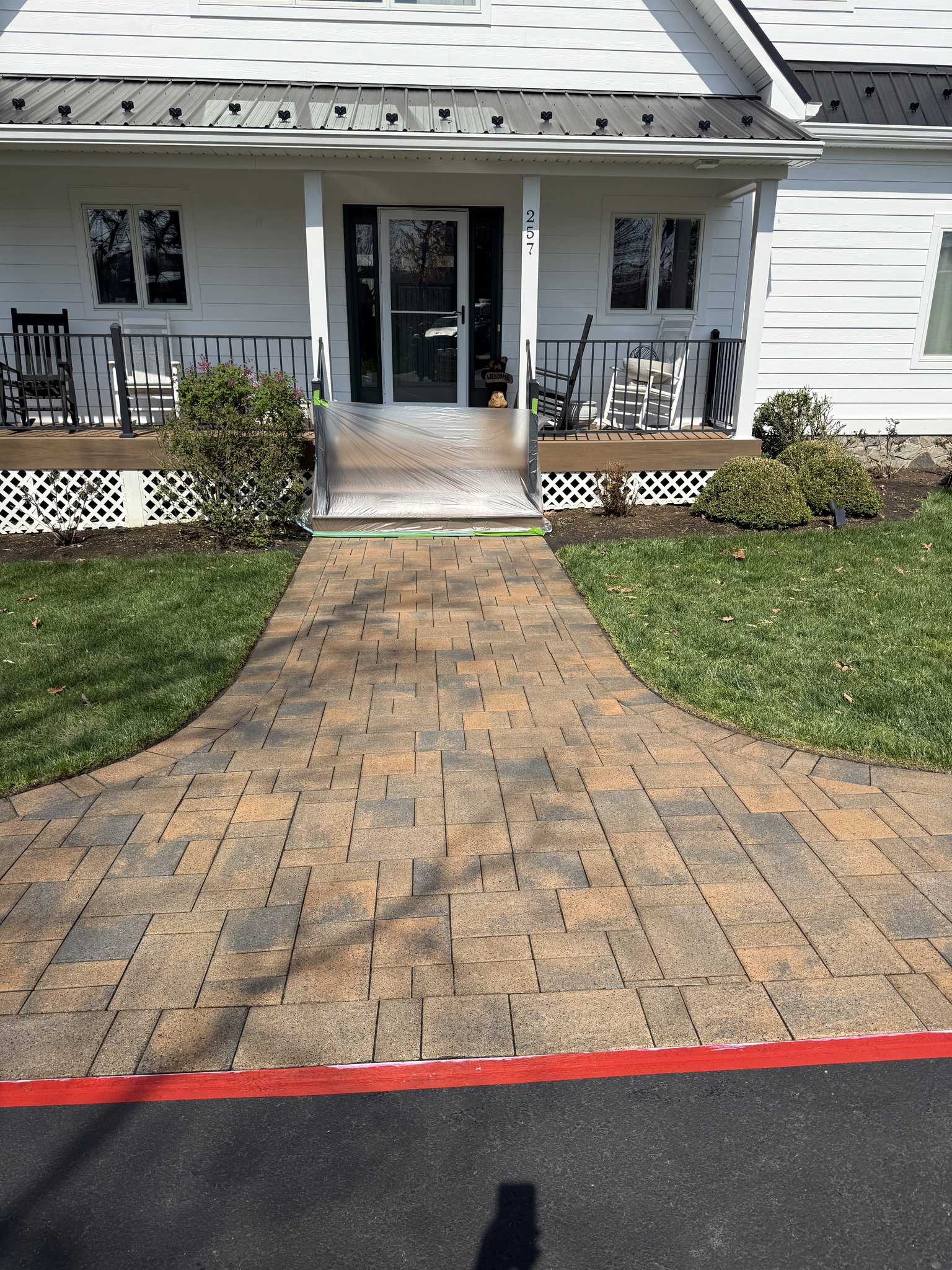 Finished paver walkway after cleaning, sanding, and sealing in Union Hall, VA — restored tan and charcoal color