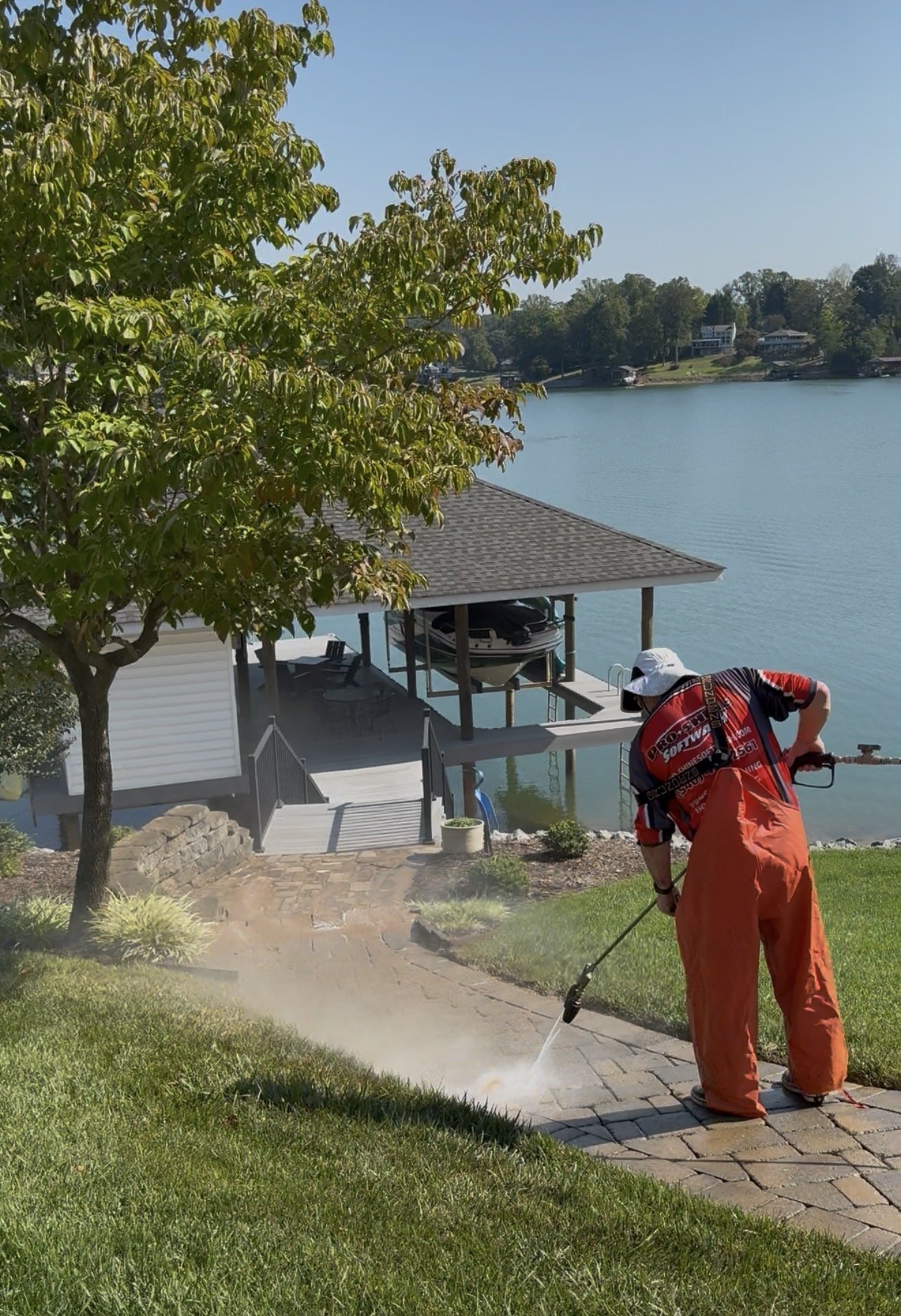 Cleaning the lower run of the paver walkway near the dock at Smith Mountain Lake