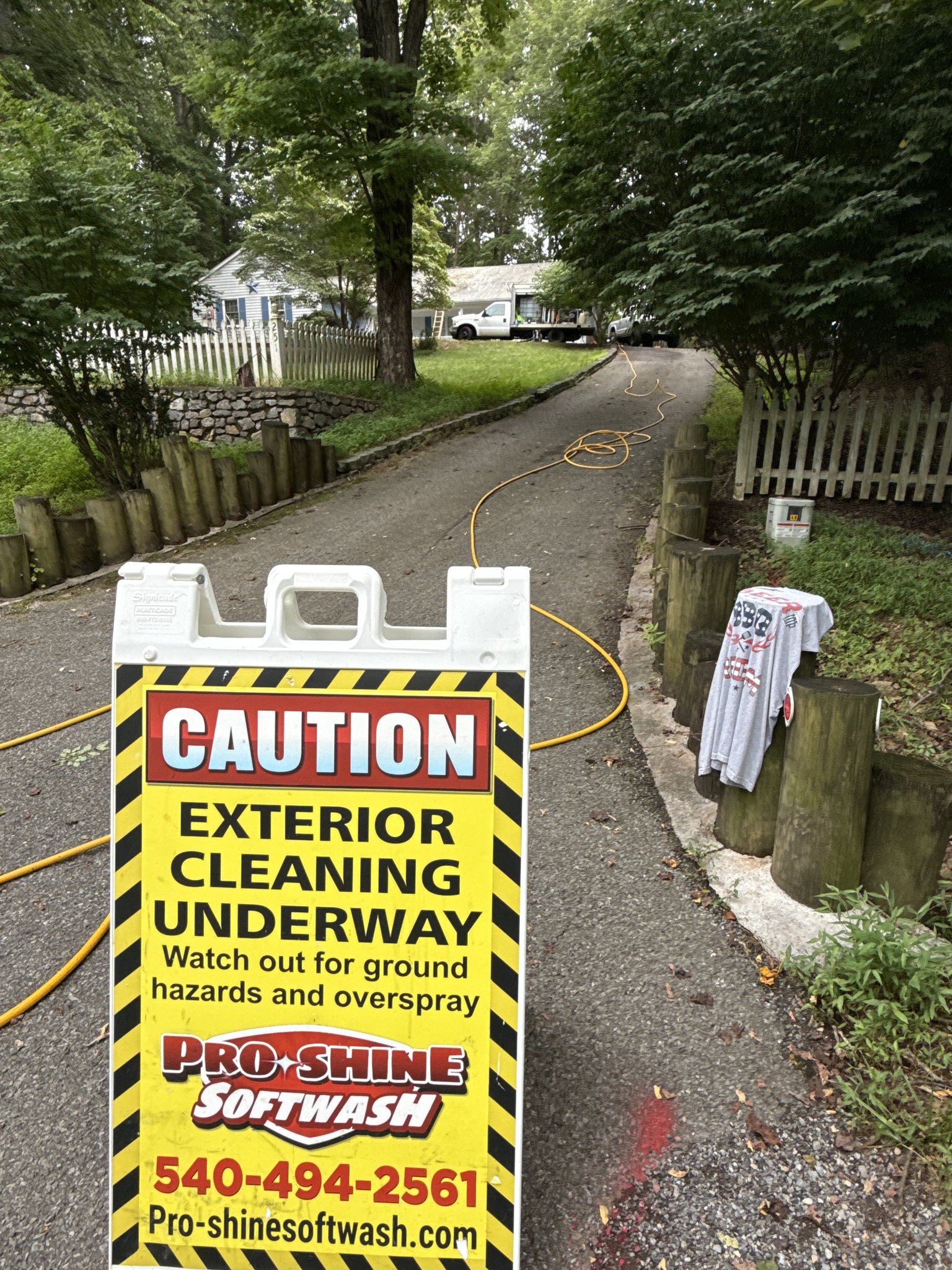 Pro-Shine Softwash jobsite signage during roof cleaning in the Eastlake area