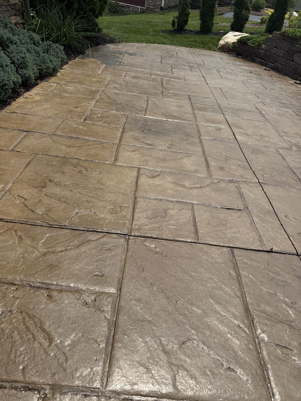 Glossy sealed stamped concrete walkway detail