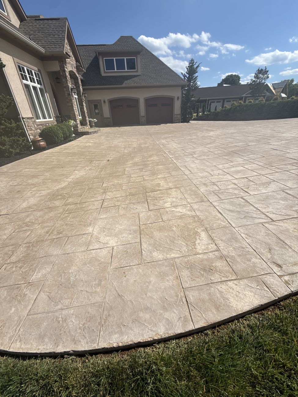 Stamped concrete courtyard cleaned and drying, ready for sealer